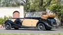 Left side view vintage Lagonda in Ivory with Black wheel arches and convertible roof open