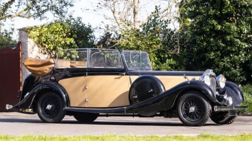 Right side view vintage Lagonda in Ivory with Black wheel arches
