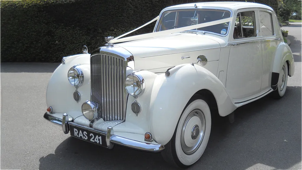 White Bentley R-type with wedding ribbons