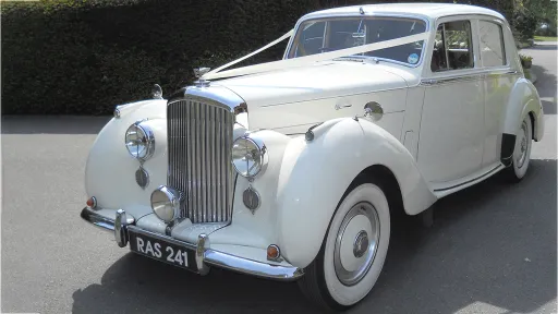 White Bentley R-type with wedding ribbons