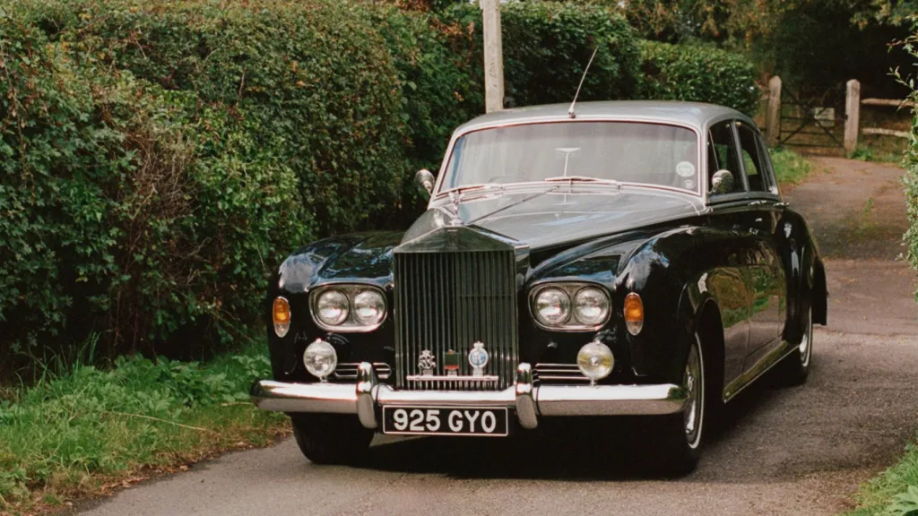 green Rolls-Royce Silver Cloud wedding car with silver roof