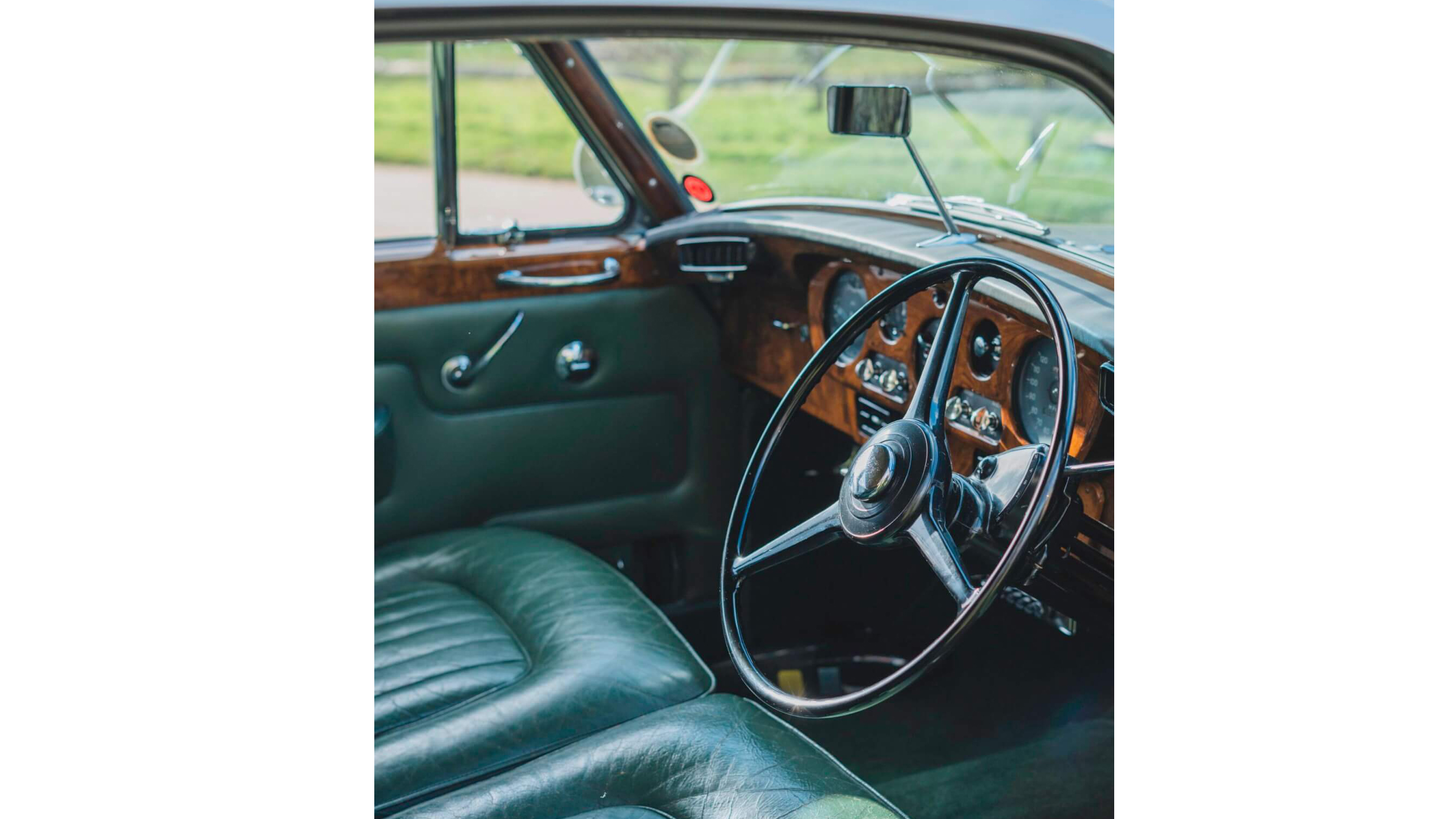 classic Rolls-Royce interior with Green Leather seats, Green Carpet, wood veneer dashboard and steering wheel