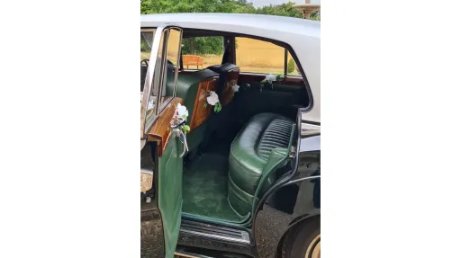 green leather seating inside vintage Rolls-Royce Silver Cloud