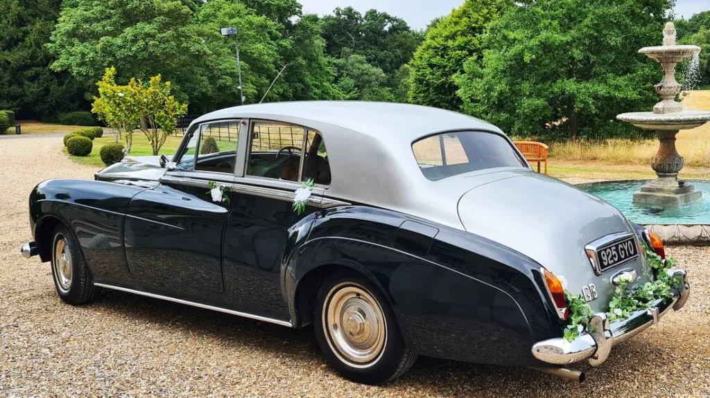 rear view of silver roof and green body Rolls-Royce Silver Cloud wedding car