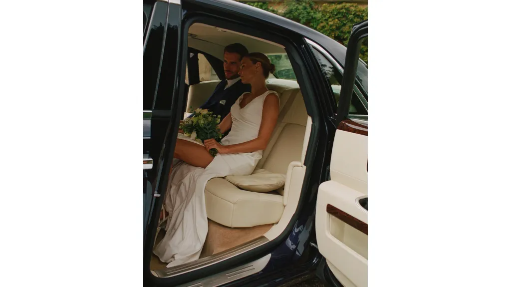luxury cream leather interior inside Rolls-Royce Ghost wedding car with Bride and groom seating inside the vehicle