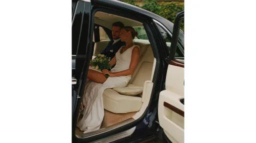 luxury cream leather interior inside Rolls-Royce Ghost wedding car with Bride and groom seating inside the vehicle