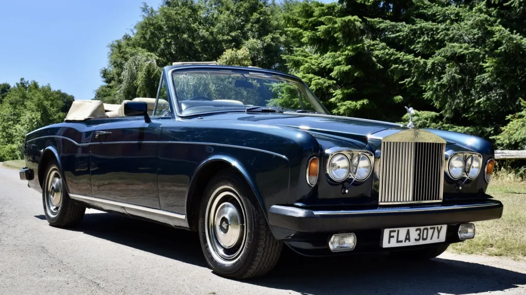 Dark Blue Rolls-Royce Corniche with convertible roof open,
