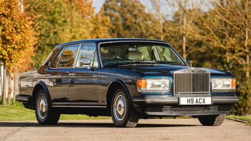 front side view of blue Rolls-Royce Silver Spirit wedding car