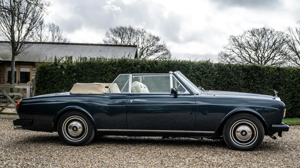 Right side view blue corniche with convertible roof open