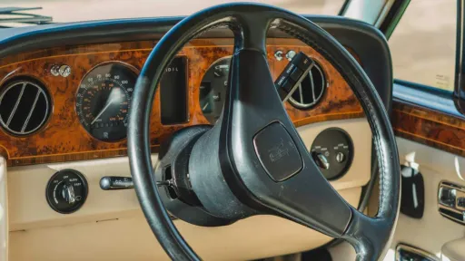 classic wooden dashboard and steering wheel in Rolls-Royce Silver Spirit
