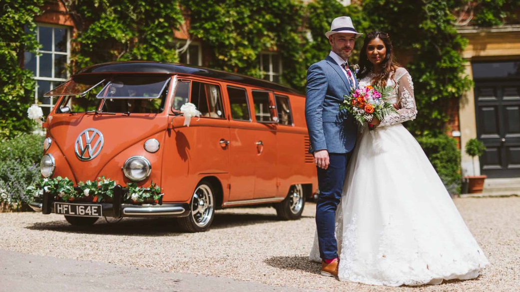 Bride and Groom with a classic Volkswagen Splitscreen Campervan parked in the background