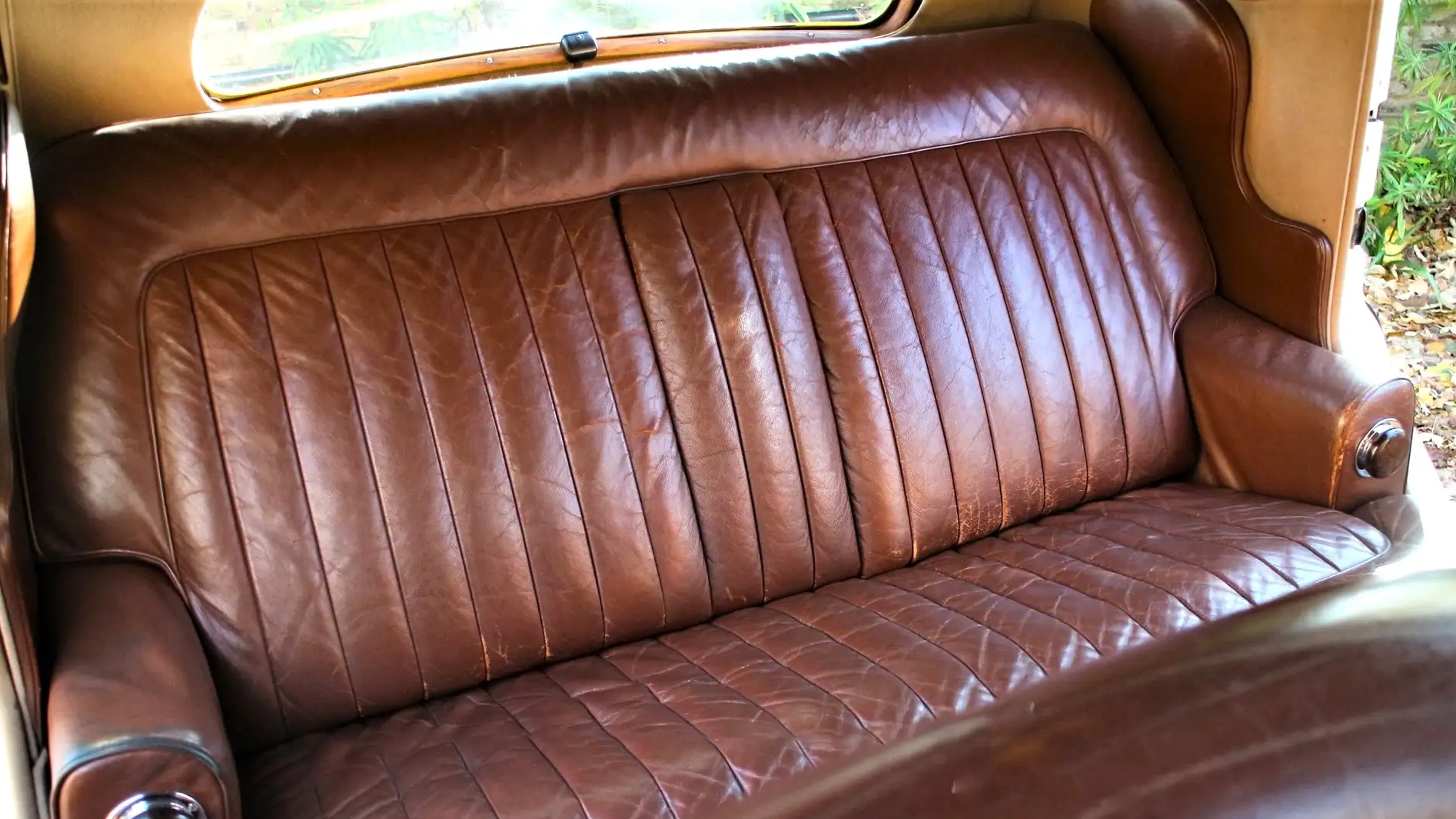 Original brown leather bencj seat inside Bentley R-type