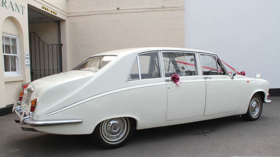 Rear right side view White Daimler limousine