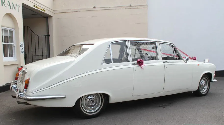 Rear right side view White Daimler limousine