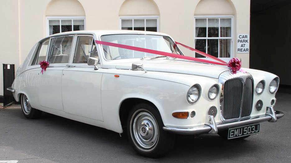 white daimler limousine