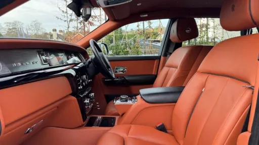 Front passenger interior with brown leather seats in Rolls-Royce Phantom VIII