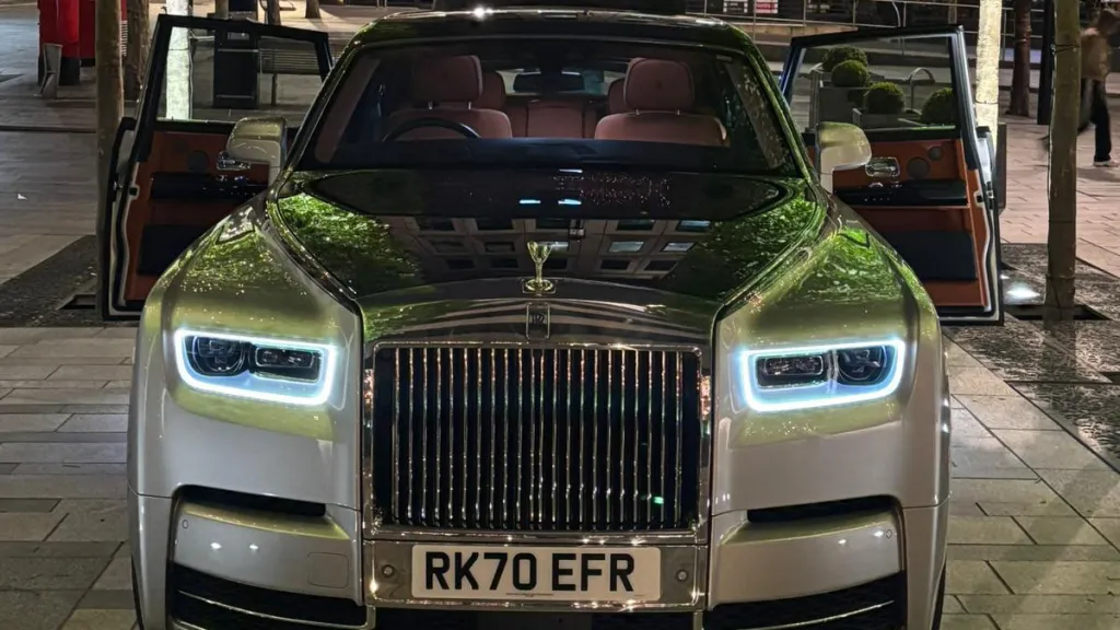 Front view of black and silver Rolls-Royce Phantom VIII with iconic chrome grille