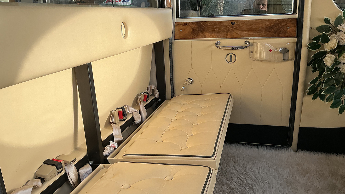 Rear interior cream casual seats inside Imperial Car