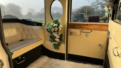 Rear interior cream leather bench seat inside Imperial Car