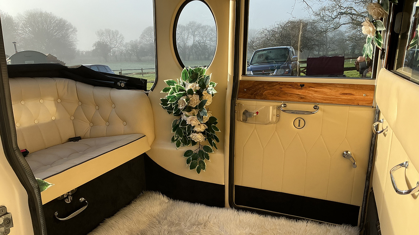 Rear interior cream leather bench seat inside Imperial Car