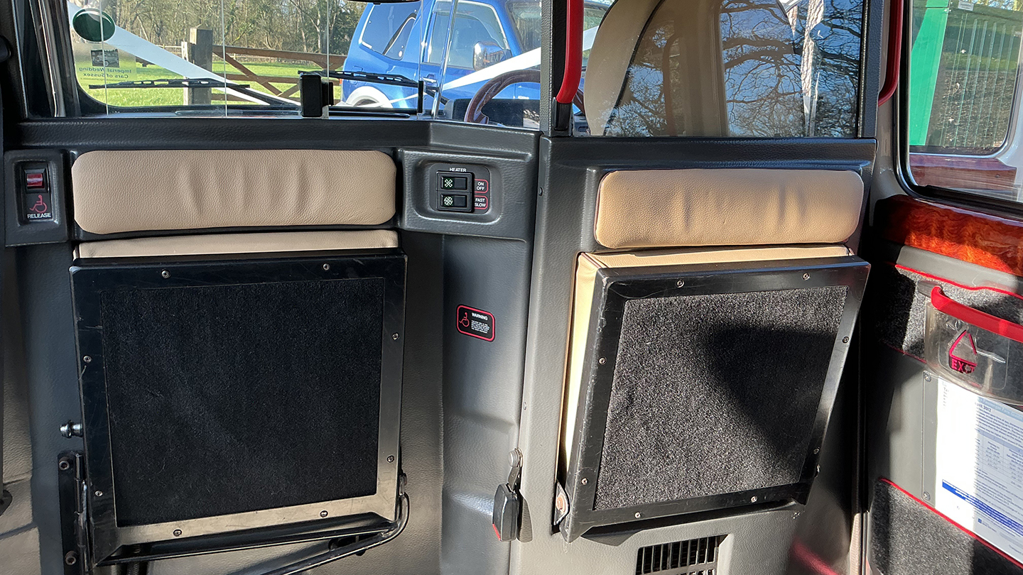 Rear casual extra seats inside a taxi cab