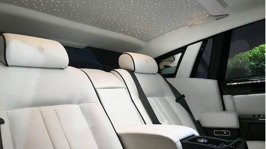 White leatehr interior inside rolls-Royce Phantom with starlight roof