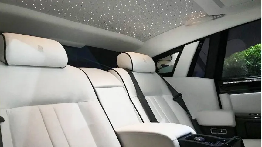 White leatehr interior inside rolls-Royce Phantom with starlight roof