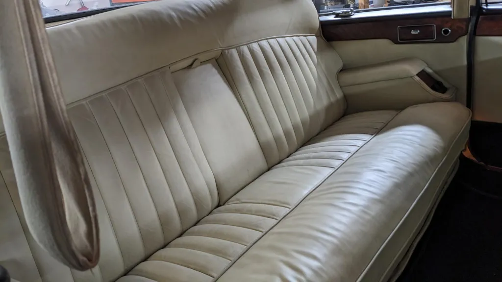 Cream leather rear bench seat inside Daimler Ds420 Limousine