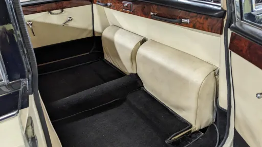 Rear interior cabin with casual seats closed up showing large rear space inside classic Daimler Limousine