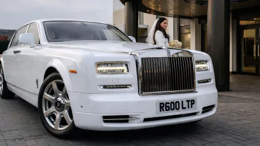 White Rolls-Royce Phantom Series 2 Extended Wheelbase parked outside a venue, showcasing its long elegant body.