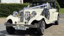 Cream 4 door Beauford wedding car parked in Warrington, Cheshire, with chrome details and classic styling.