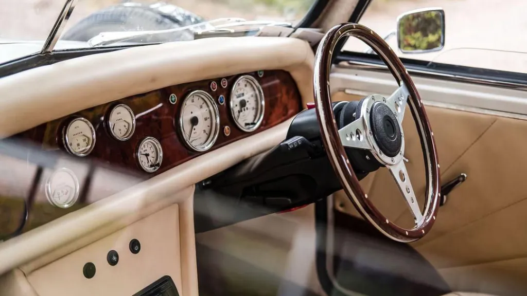 Classic Beauford dashboard and steering wheel with vintage dials and cream interior trim