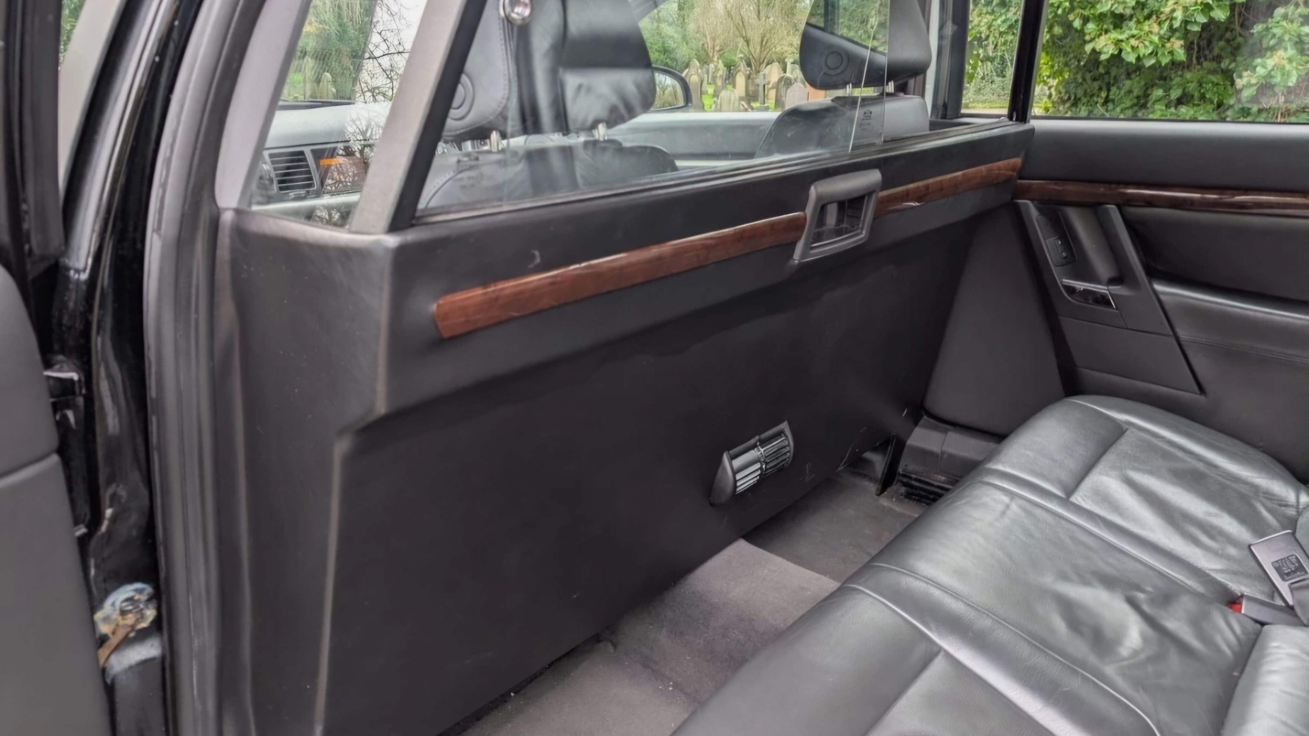 Interior of stretched Vauxhall Vectra limousine showing glass partition