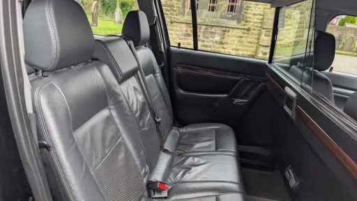 nterior view of 7-seater stretched Vauxhall Vectra limousine with wooden trim