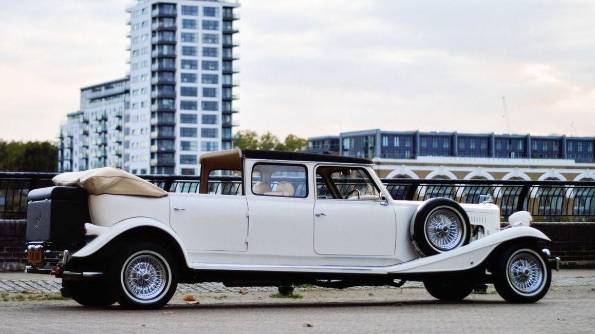 Beauford Landaulette limousine side view with rear roof folded open showing convertible section