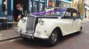 Classic Austin Princess limousine in black and ivory parked in Maidstone town centre for wedding hire.