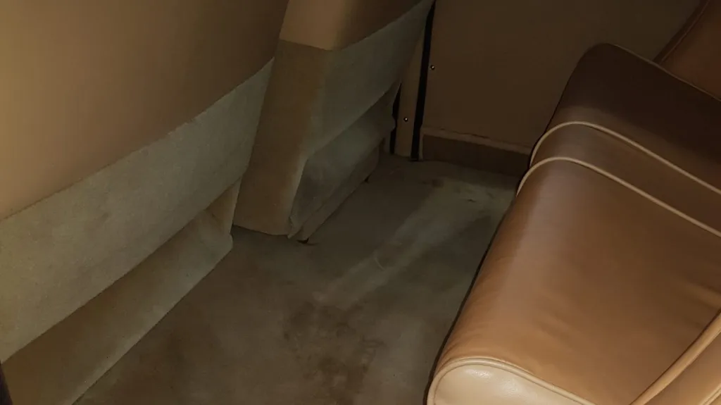 Interior footwell and cream leather rear seating area inside classic 1935 Austin 18 York wedding car.