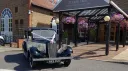1935 Austin 18 York vintage wedding car parked outside Tudor Park wedding venue in Kent.