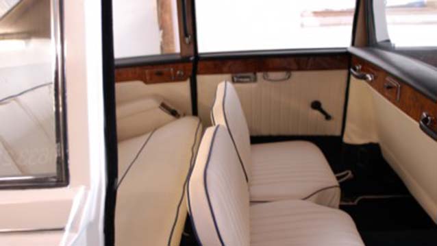 Classic Daimler Limo cream leather interior with casual seats raised up