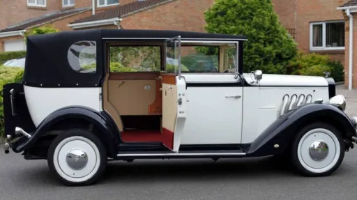 Right side view of Black and Ivory Regent car with rear passenger door open showing cream leather seats and burgundy carpet