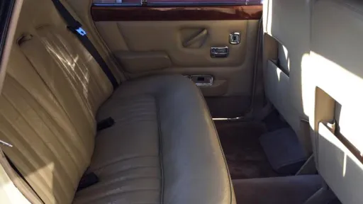 Rear cream leather interior of a 1970 Rolls-Royce Silver Shadow Mark 1 wedding car.