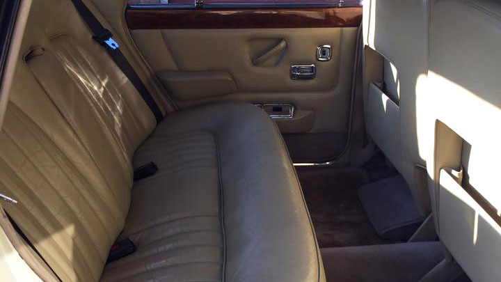 Rear cream leather interior of a 1970 Rolls-Royce Silver Shadow Mark 1 wedding car.