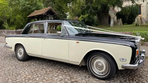 Classic Rolls-Royce Silver Shadow Mark 1 with white wedding ribbons on the bonnet.