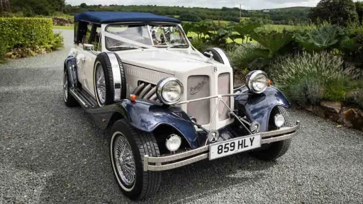 Ivory and navy Beauford convertible wedding car parked in Maidstone, Kent with chrome detailing.