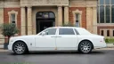 Full side profile of white Rolls-Royce Phantom Series II EWB showing extended wheelbase body design.