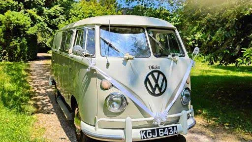 Ivory and sage green Volkswagen Split Screen campervan parked in countryside setting in the South West.