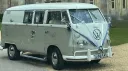 Ivory and sage green Volkswagen Split Screen campervan parked outdoors ready for a wedding in Devon.