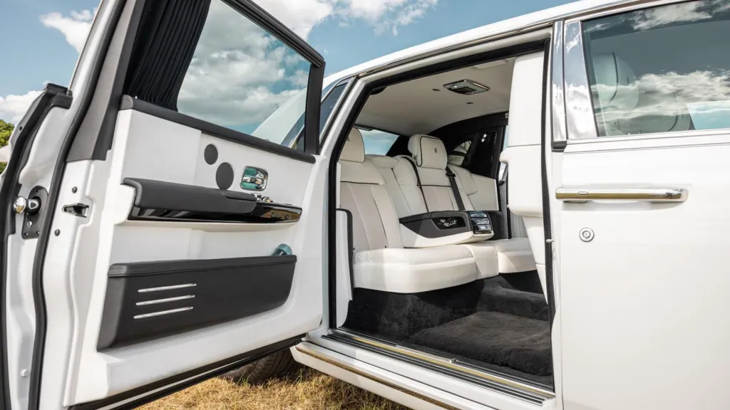 Openend rear passenger door with white leather interior