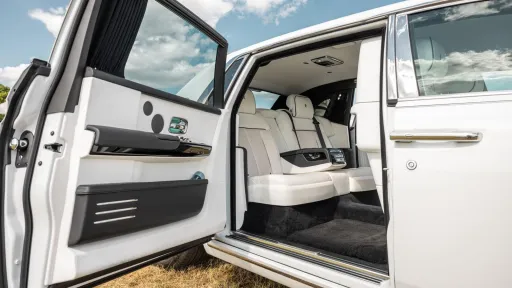Openend rear passenger door with white leather interior