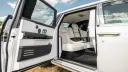 Openend rear passenger door with white leather interior